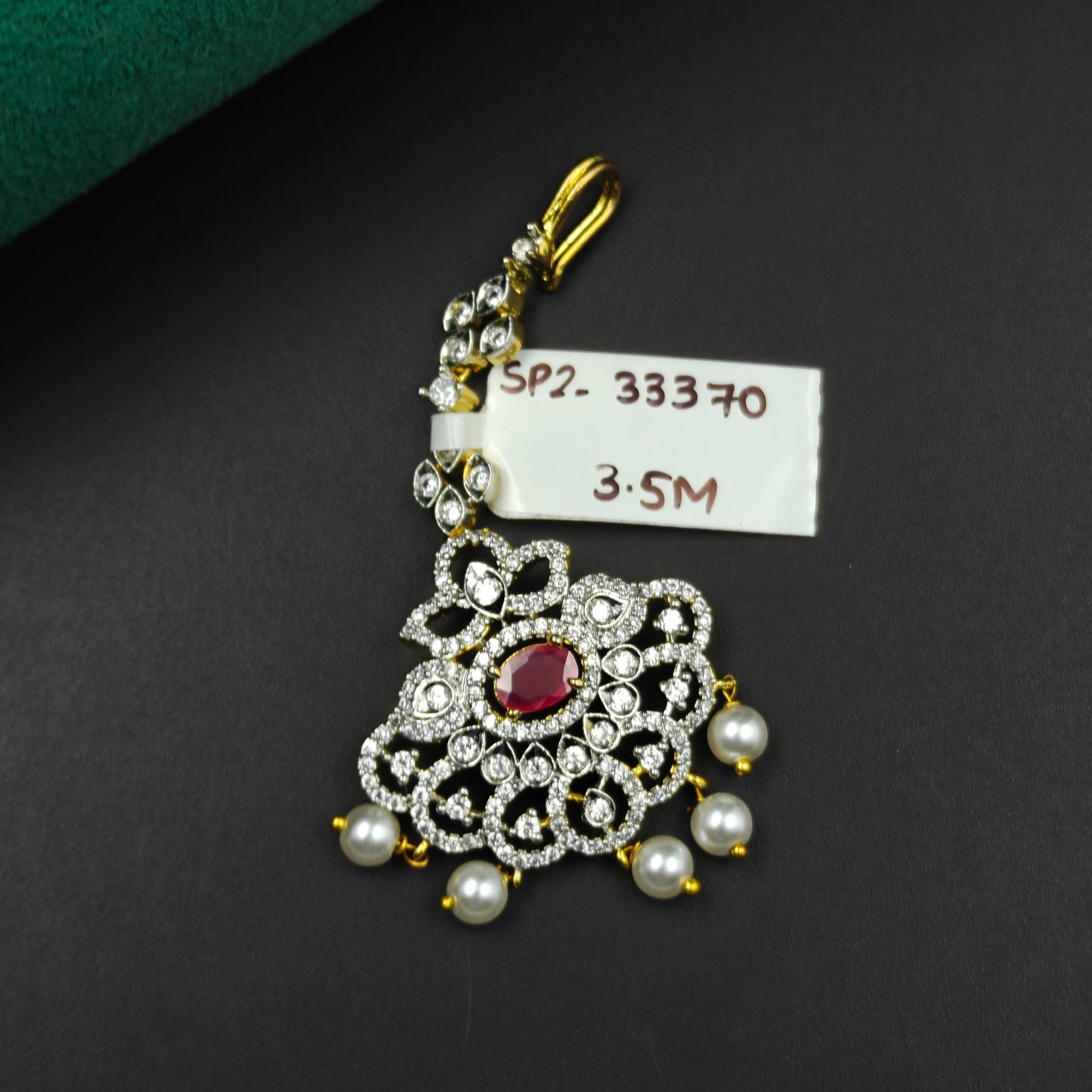 33370 Floral design maangtikka with red stone, white CZ crystals, and pearl drops