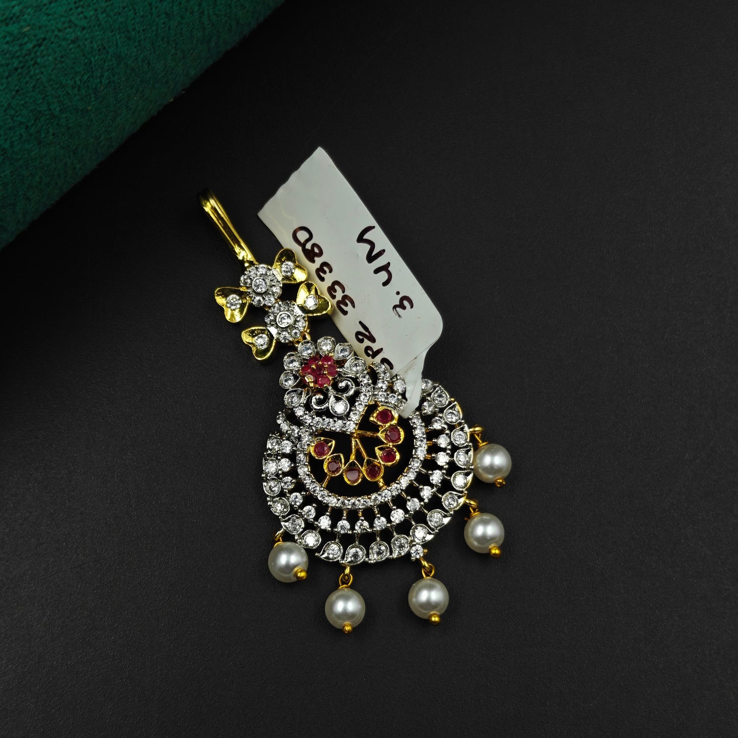 33380 Peacock design maangtikka with red stones, white CZ crystals, and pearl drops