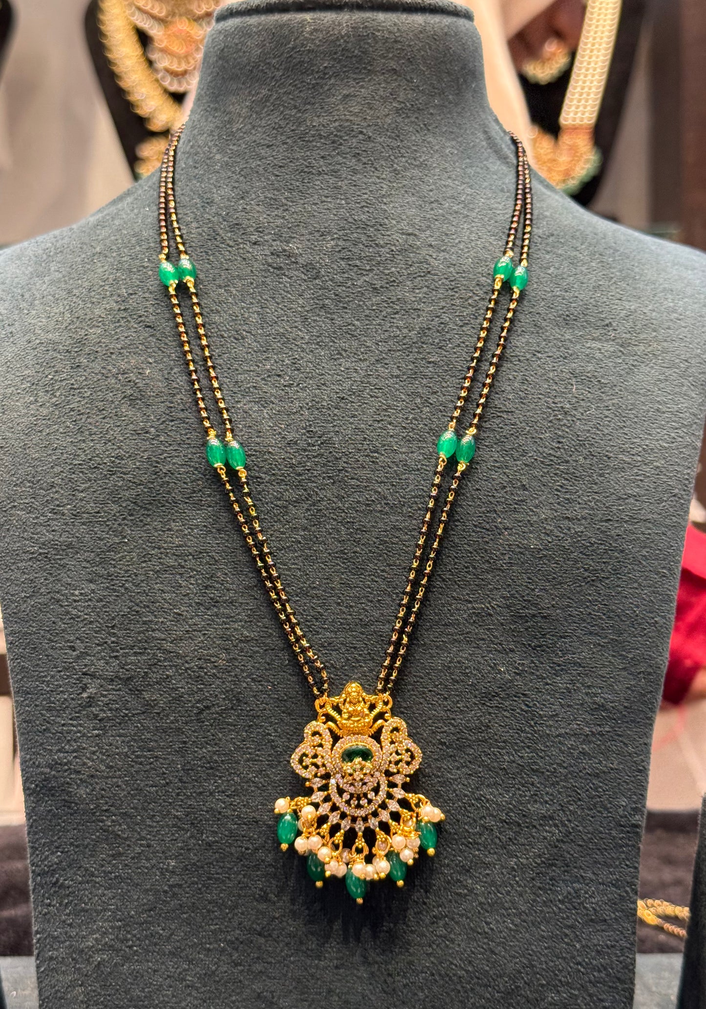 39837 2 line gold look black beads with Lakshmi locket