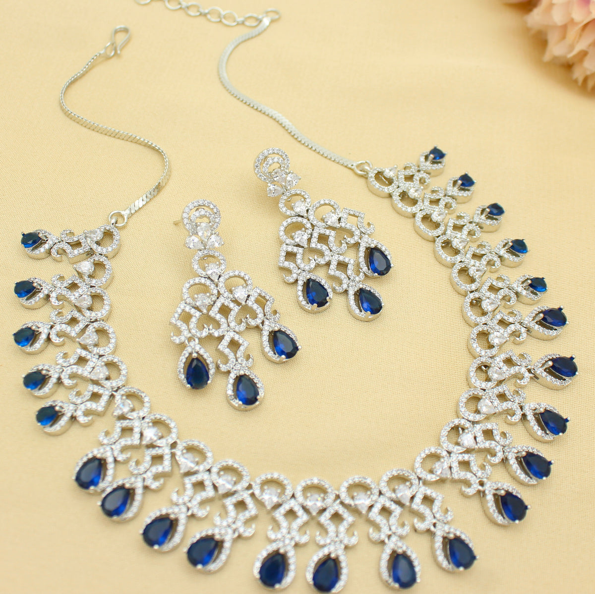 Platinum Party Wear Drop Pattern Blue Stones Short Necklace Set With Push Back Earrings 43014