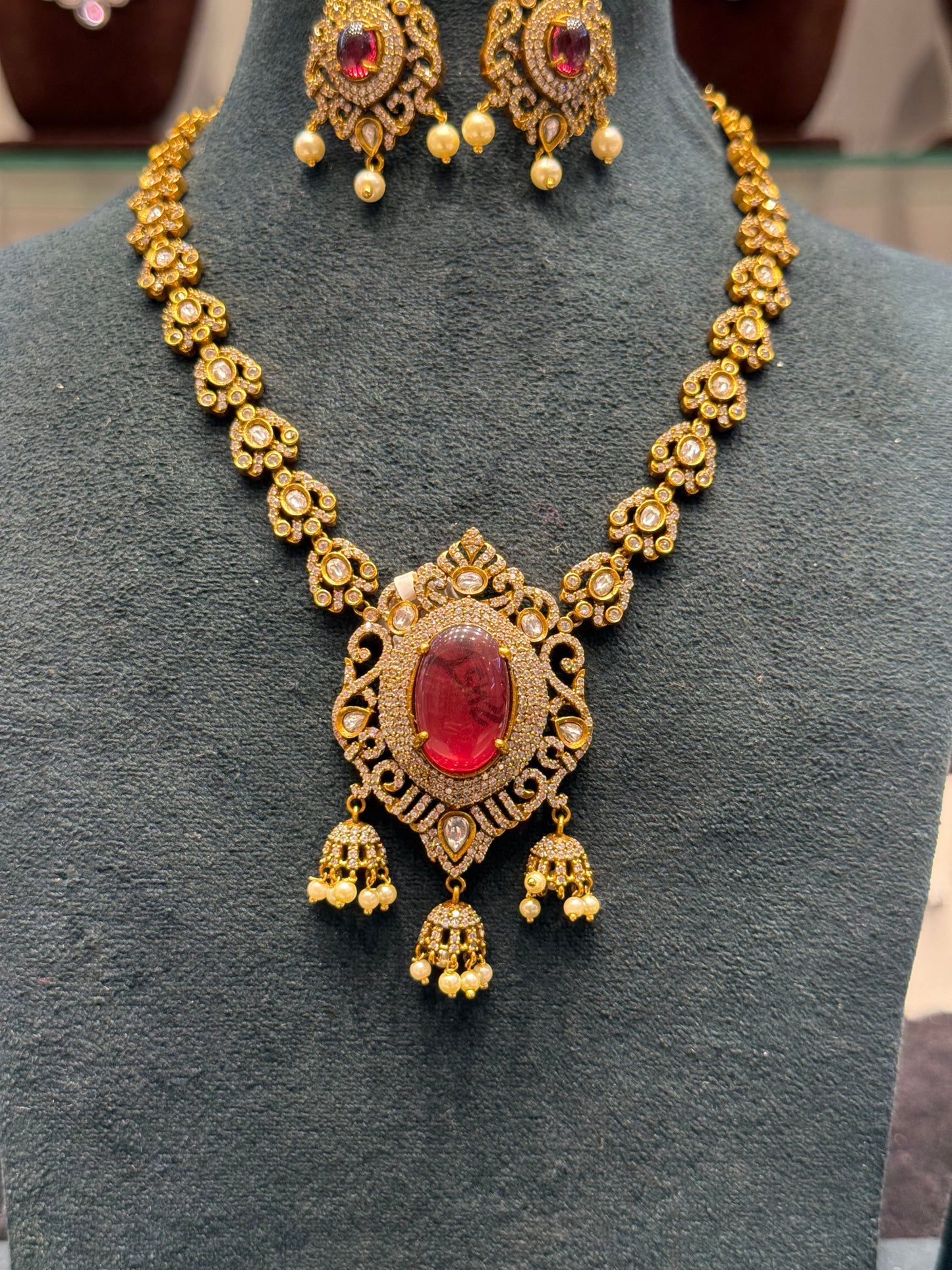 Victorian mehendi single line necklace with Chandbali and red duplet stones