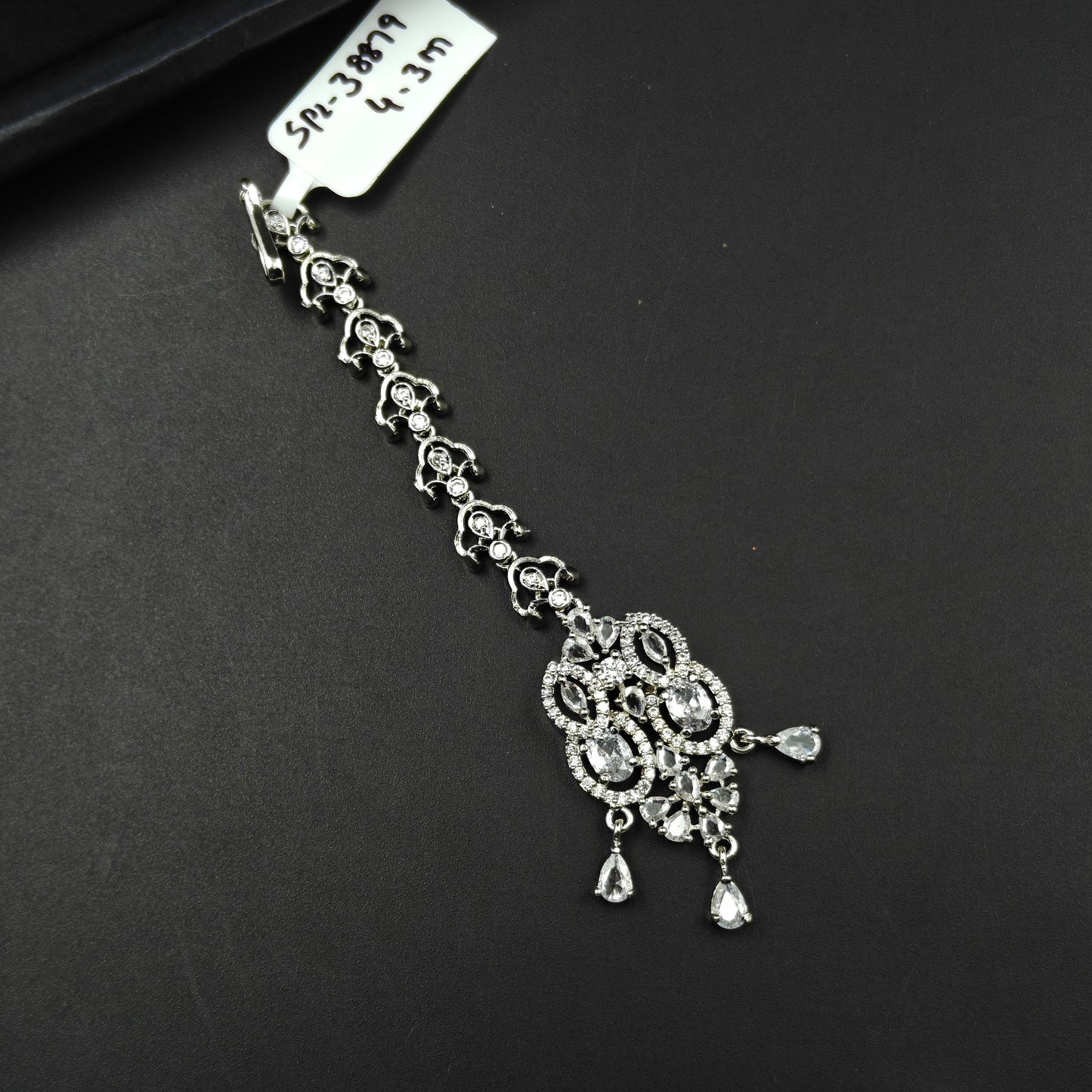 38879 Oval design maangtikka with white CZ stones