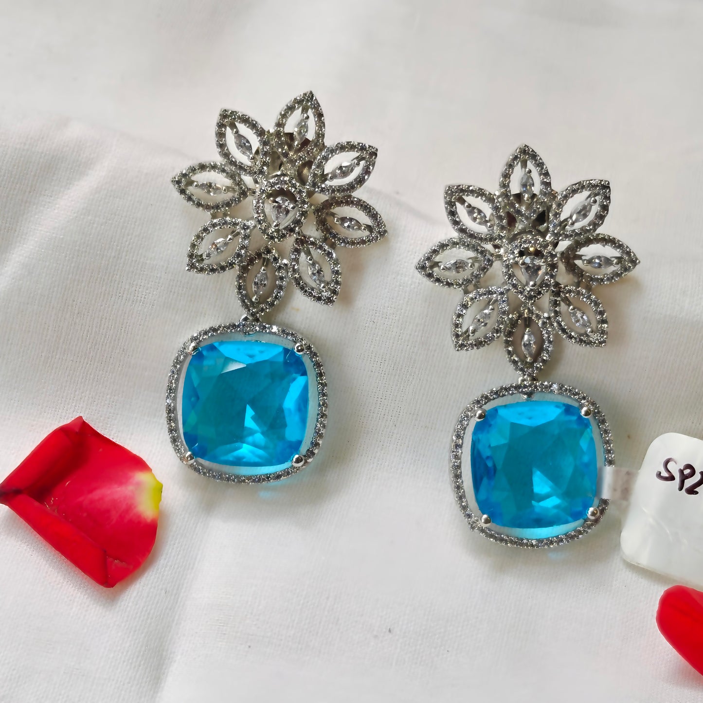 27027 platinum flower sky blue colour earrings