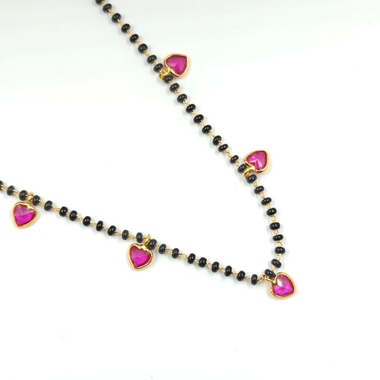 Black beads with drop and heart in red