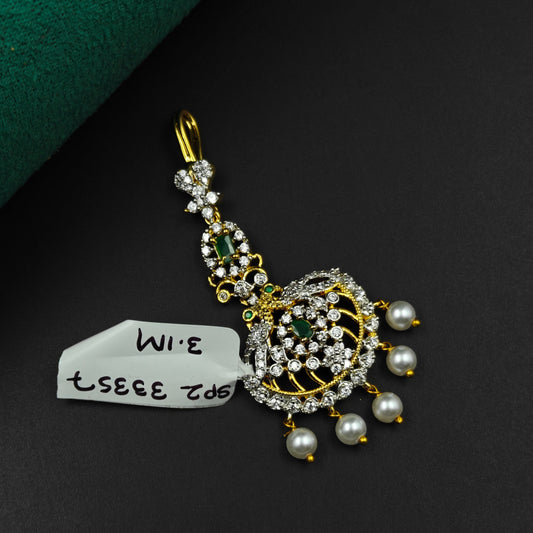 33357 Round design maangtikka with green stones, white CZ crystals, and pearl drops