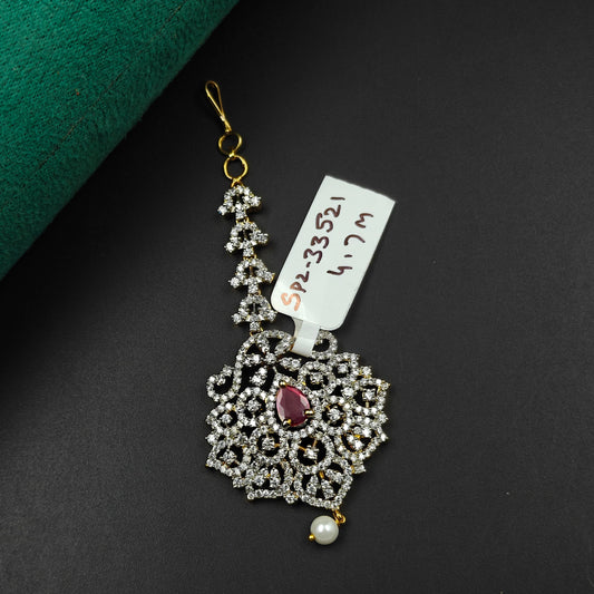 33521 Floral lattice design maangtikka with red stone, white CZ crystals, and a pearl drop