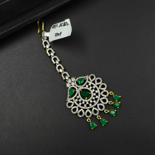 36820 Teardrop design maangtikka with green stones and white CZ crystals