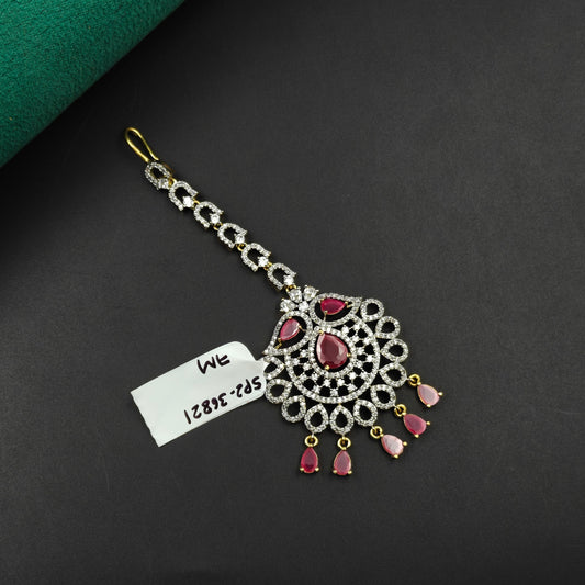 36821 Floral design maangtikka with pink stones and white CZ crystals