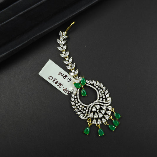 36830 Leaf design maangtikka with green stones and white crystals