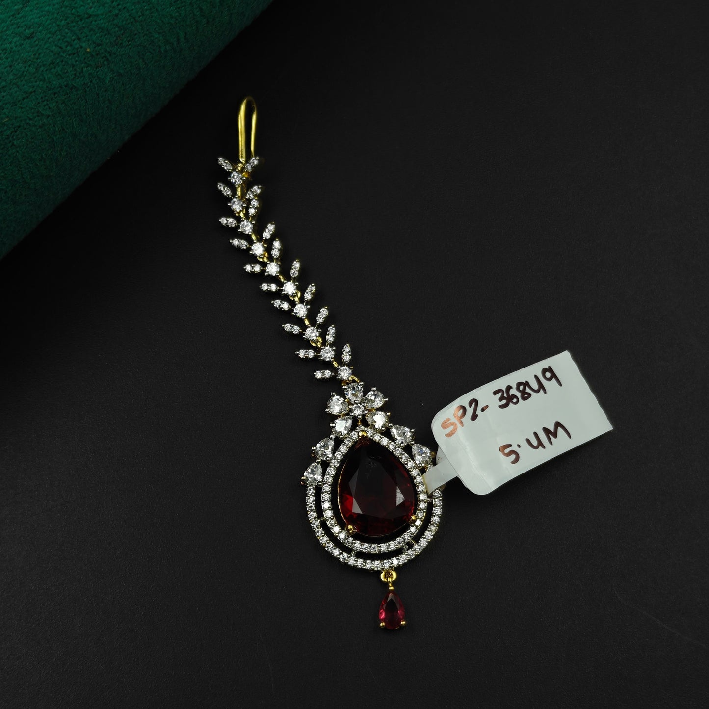 36849 Teardrop design maangtikka with maroon stone and white CZ crystals