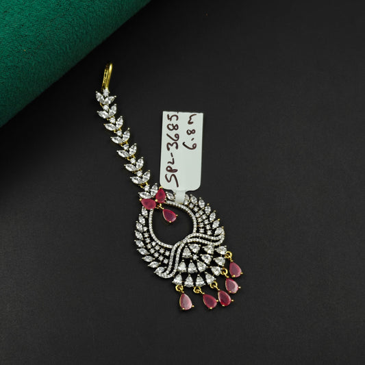 36855 Leaf design maangtikka with red stones and white CZ crystals
