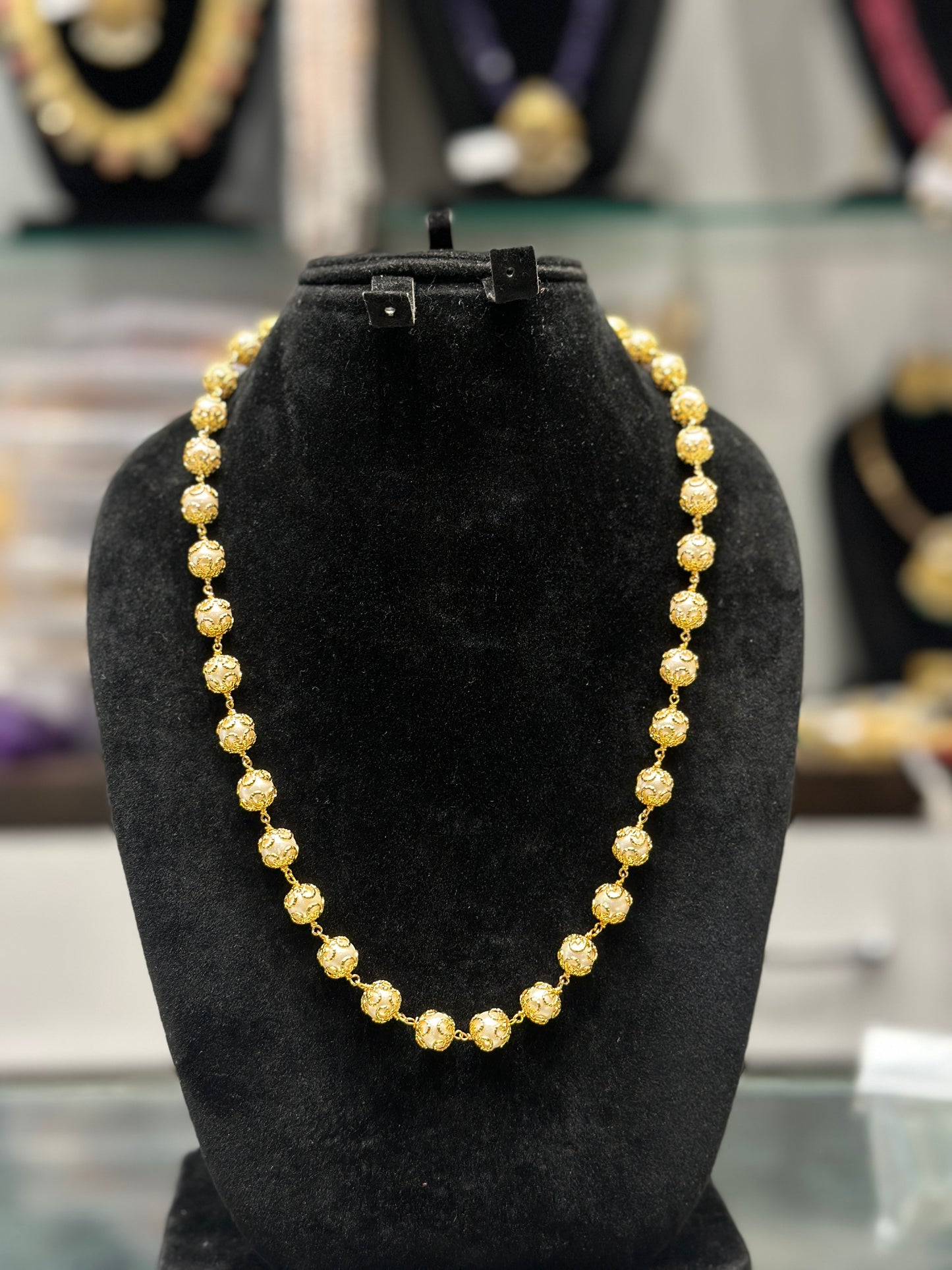 32137 Pearl mala with gold caps