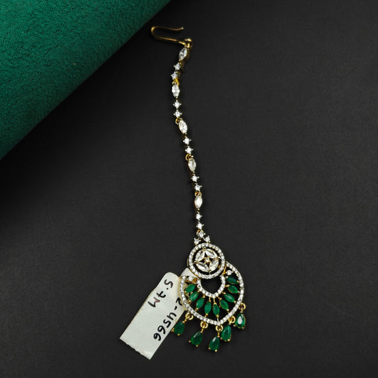 4566 Spiral design maangtikka with green stones and white CZ crystals