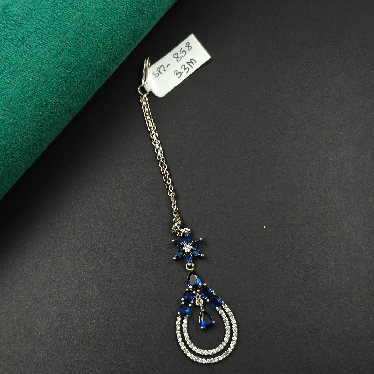 858 Teardrop design maangtikka with blue stones and white CZ crystals