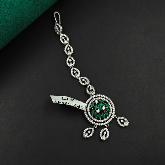 9295 Round design maangtikka with green stones and white CZ crystals