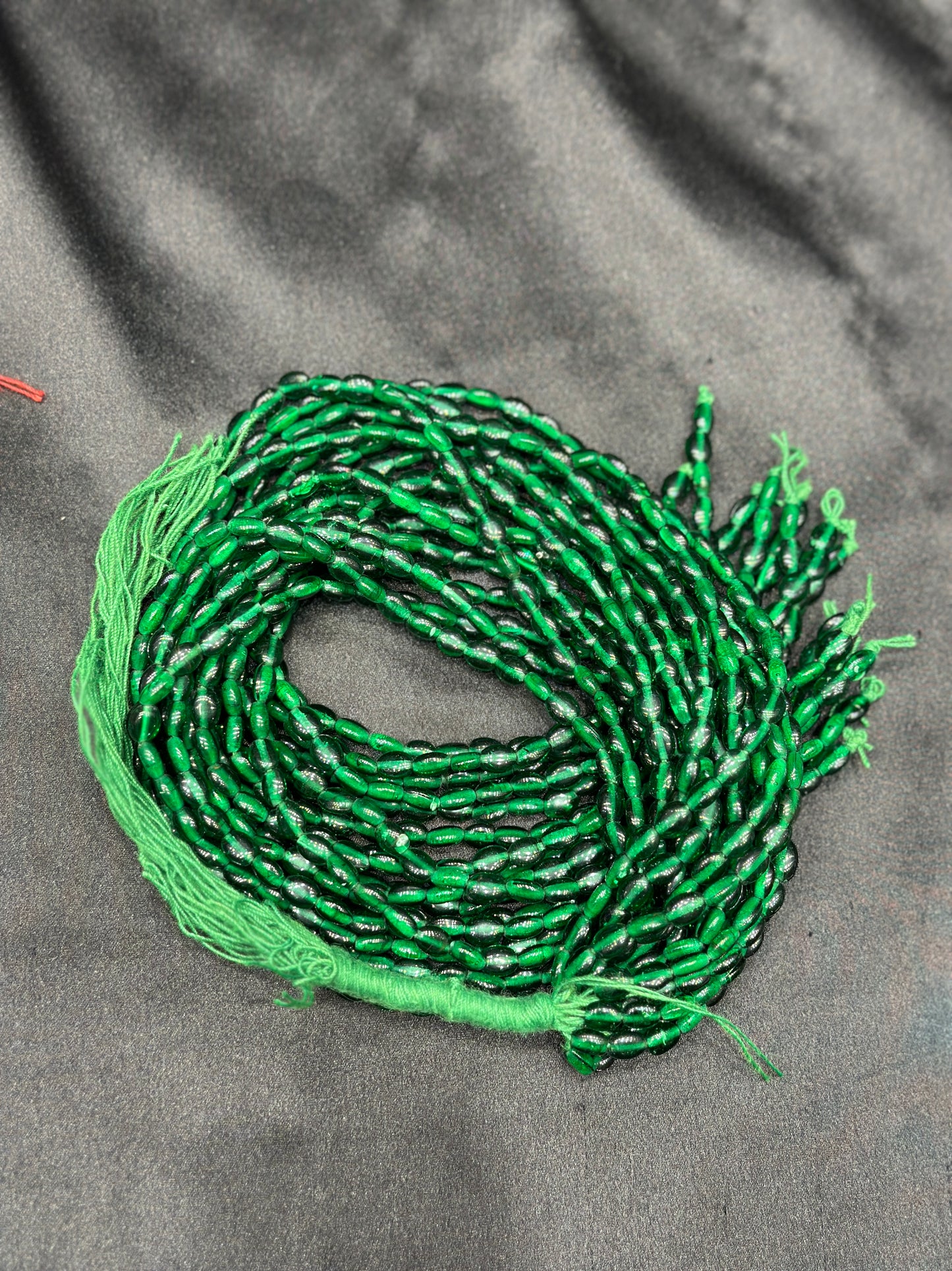 Dark green beads per line