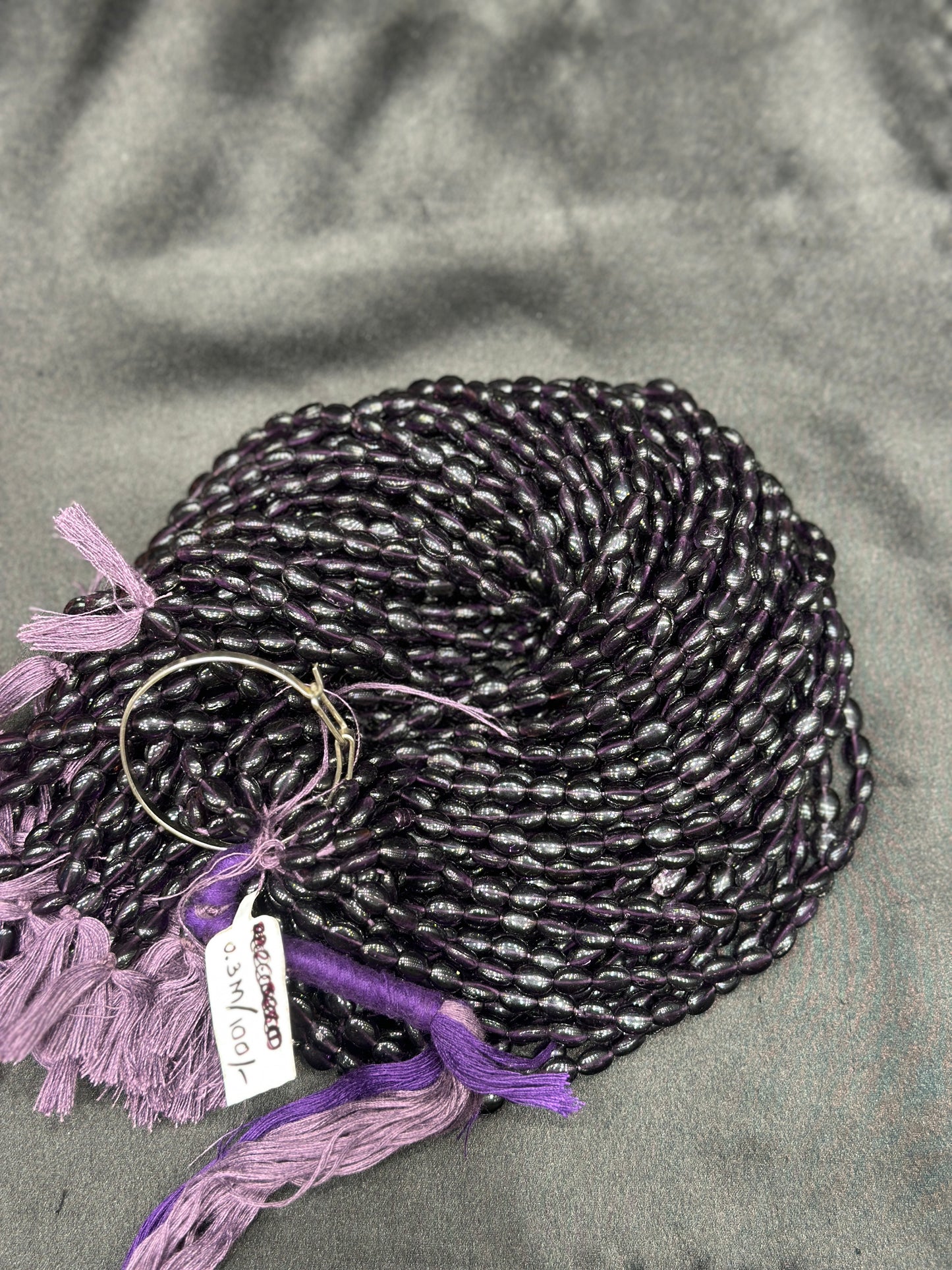 Dark purple beads per line