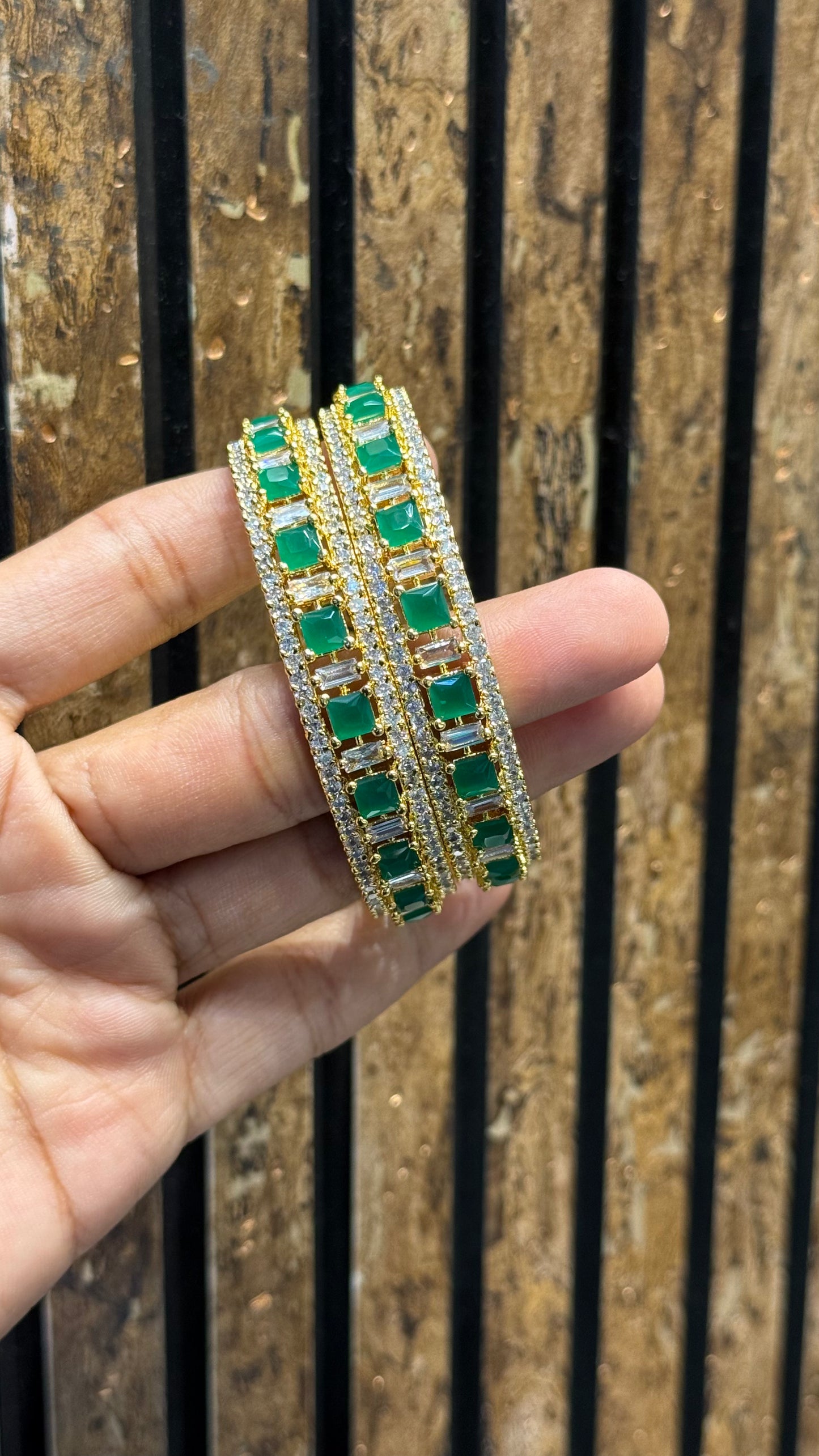 17089 Gold Polishing emerald stones bangles