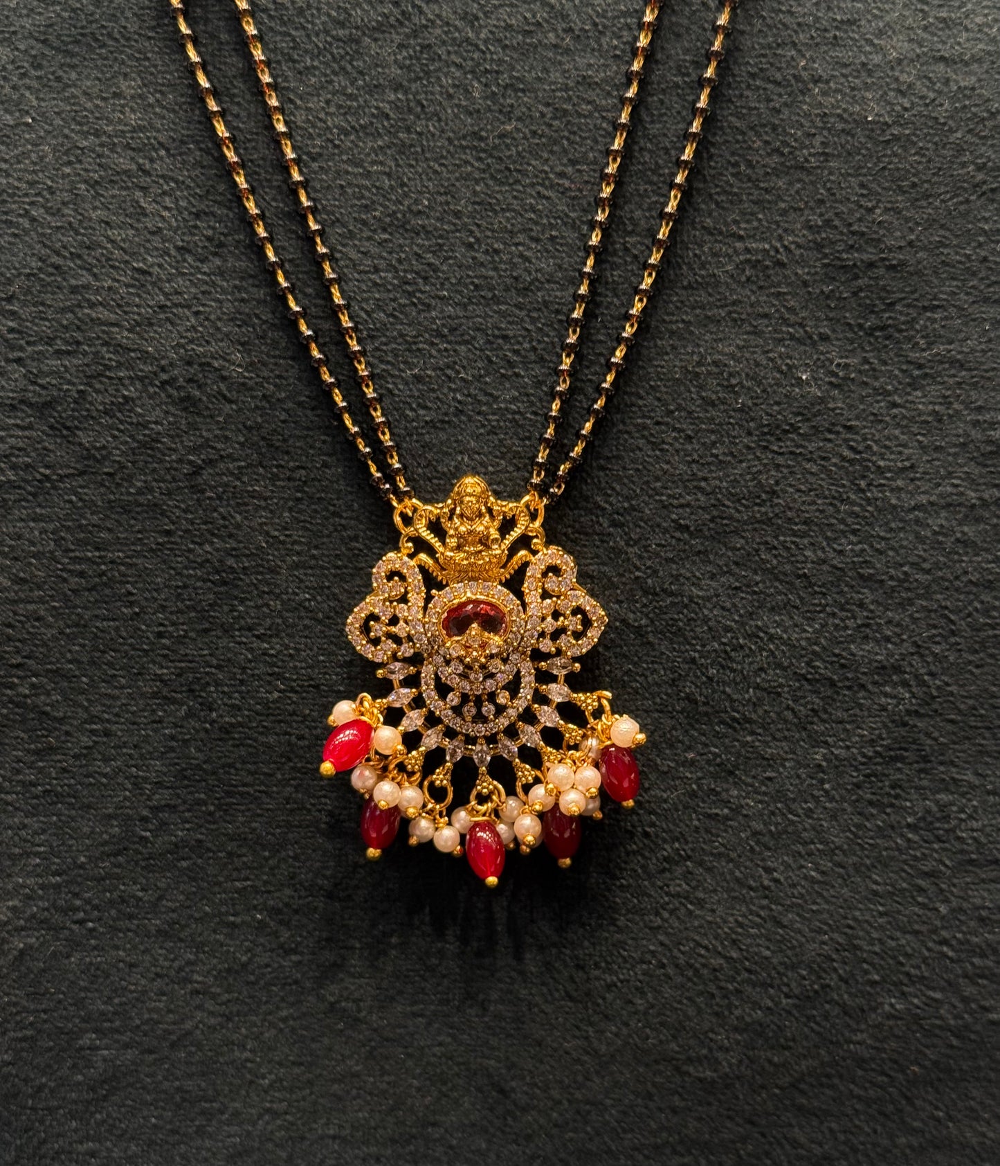 39838 2 Line gold look black beads with Lakshmi Locket