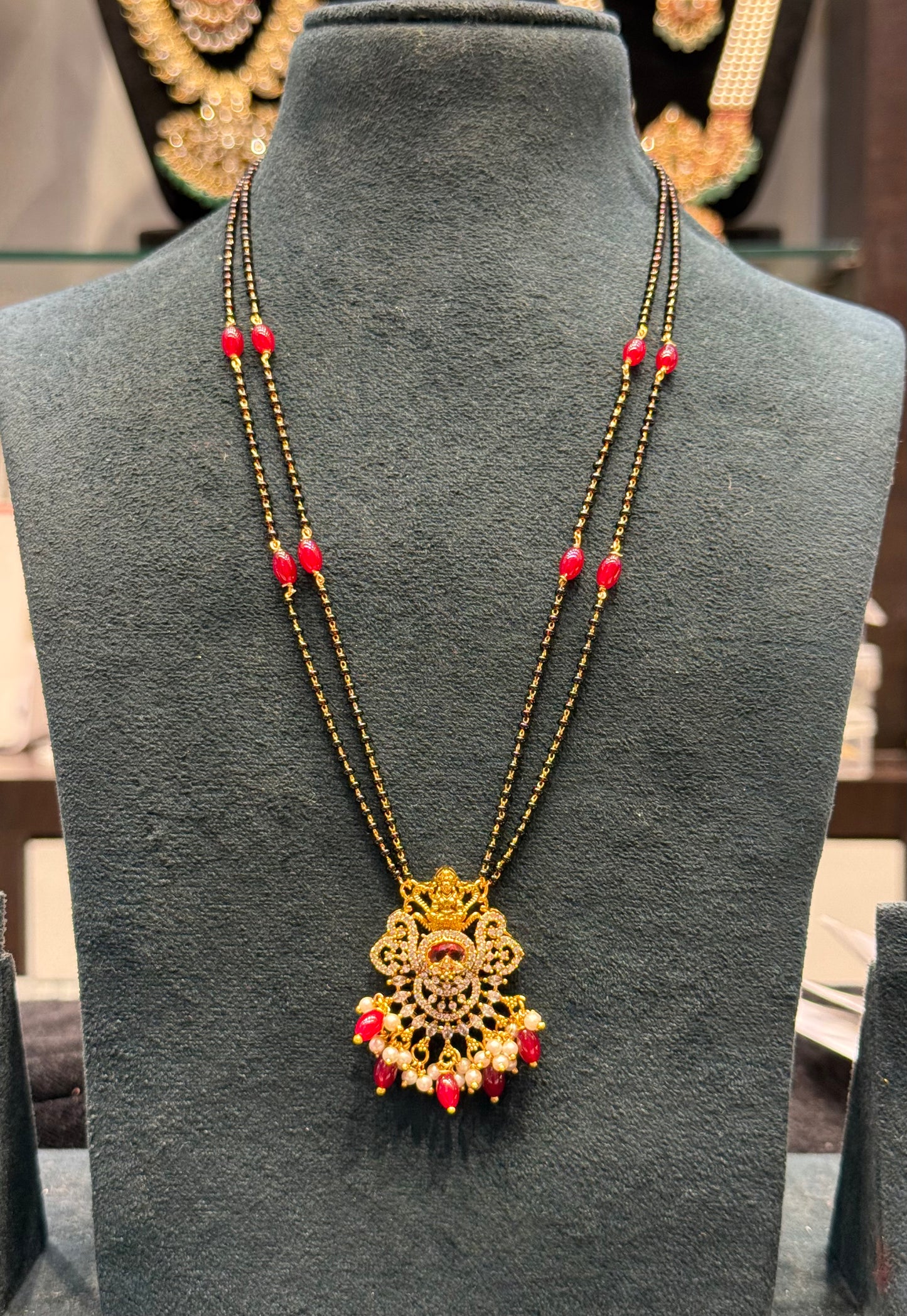 39838 2 Line gold look black beads with Lakshmi Locket