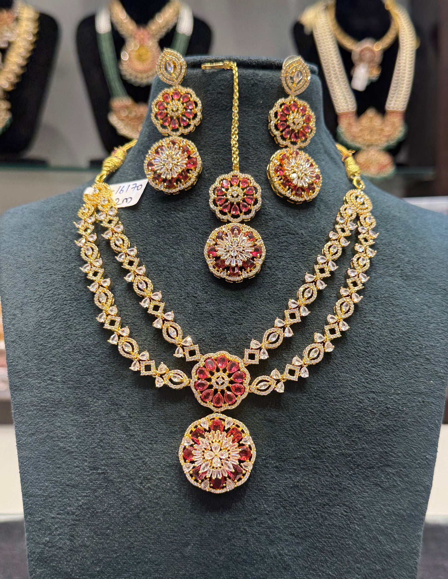 16170 Gold Polish CZ/ AD stone 2 layered necklace with red stones, earrings and Mangtikka