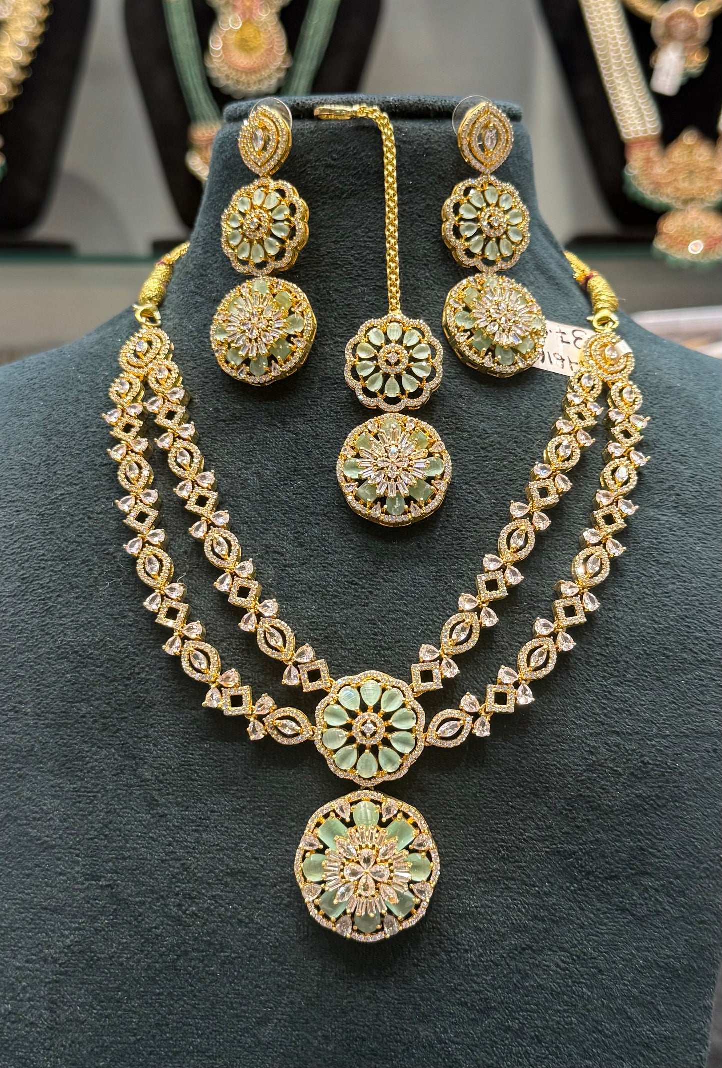 36167 gold polish CZ/AD stone 2 layered necklace with mint stone, earrings and tikka
