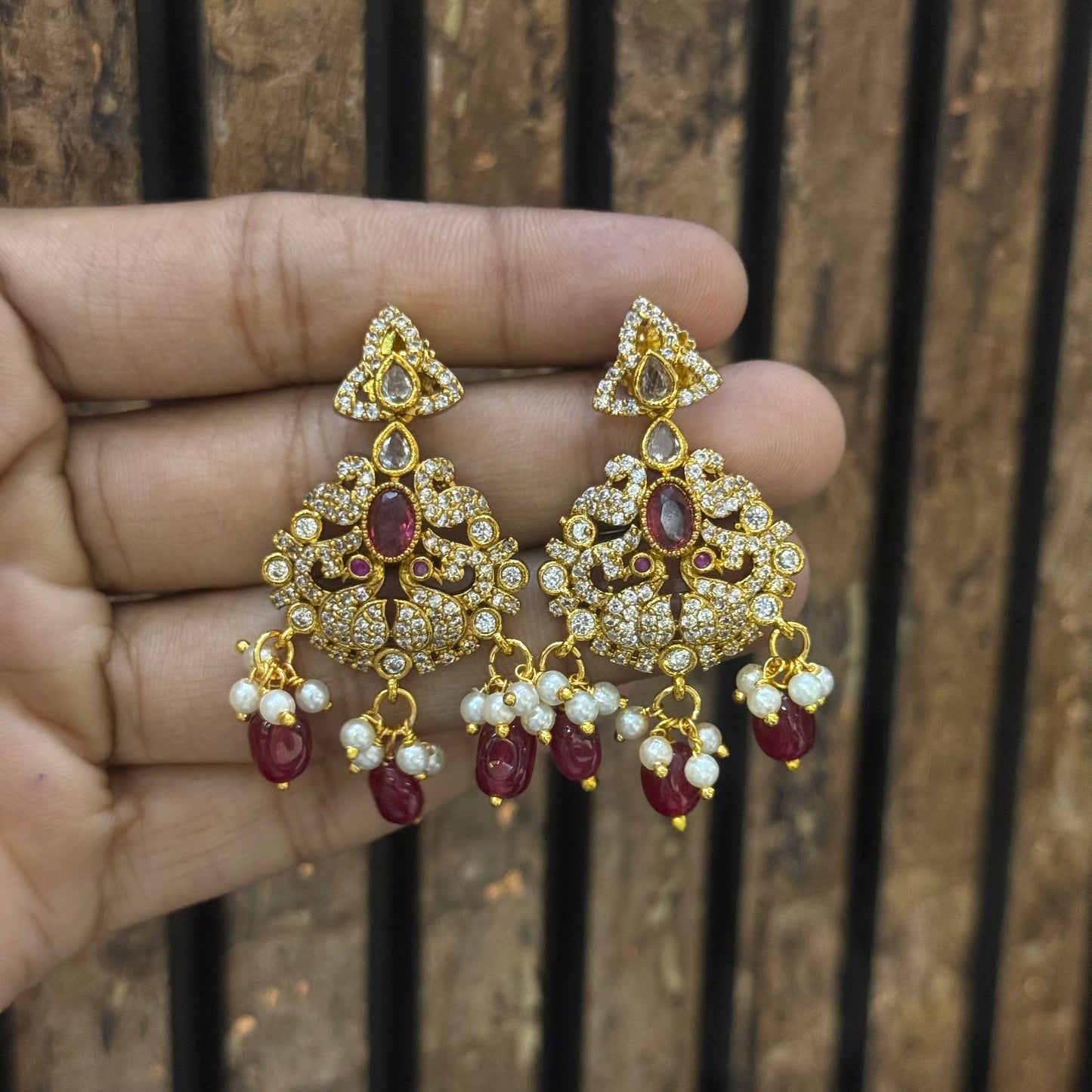 41147 Gold Chandbali with red color stones and monalisa beads