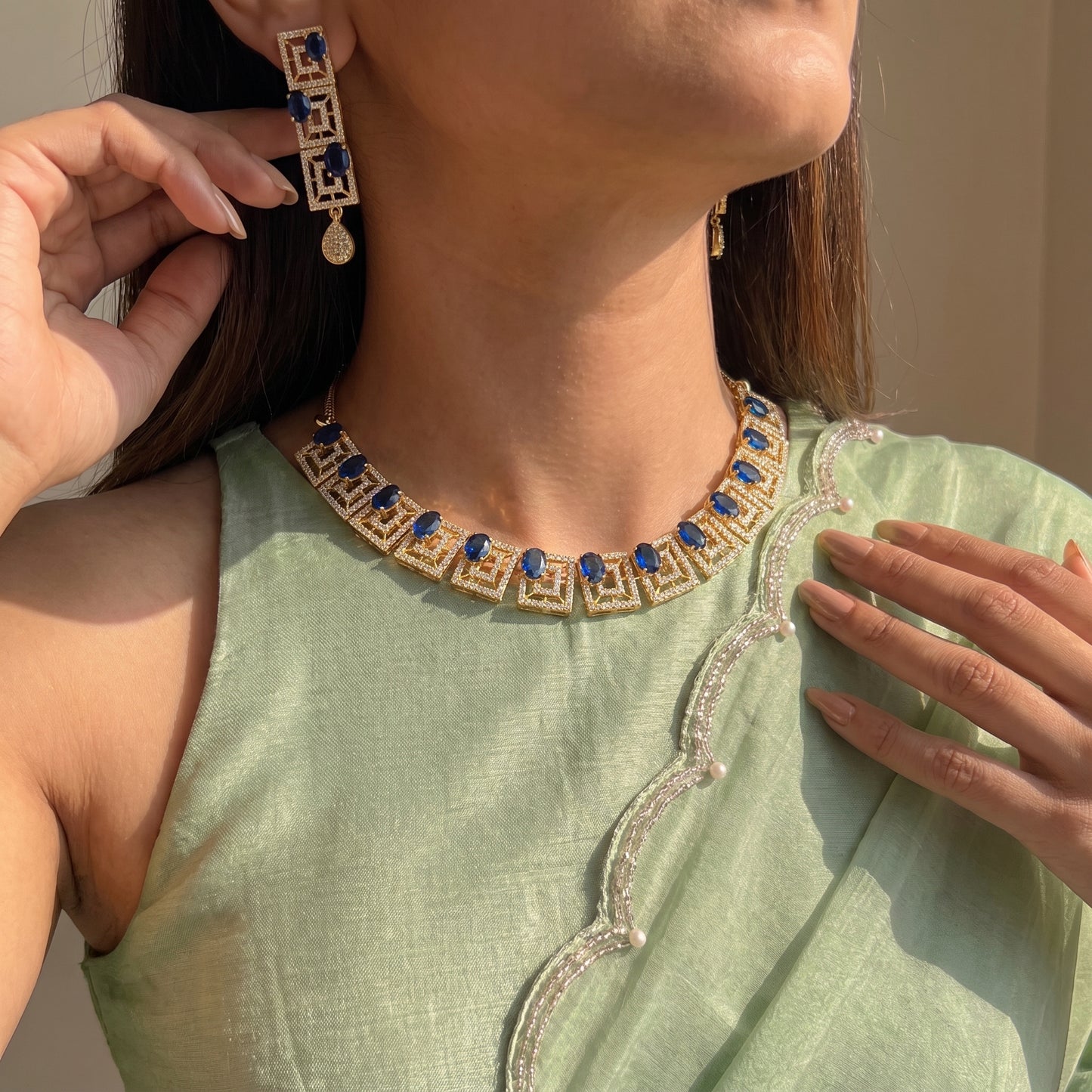 Gold polish blue stone necklace