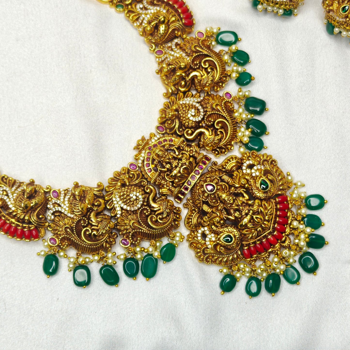 39599 Nakshi Laxmi Peacock Long Broad Necklace Set With Coral