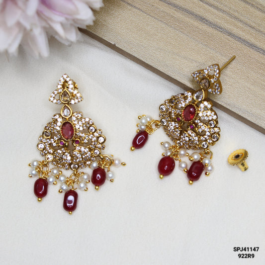 41147 Gold Chandbali with red color stones and monalisa beads