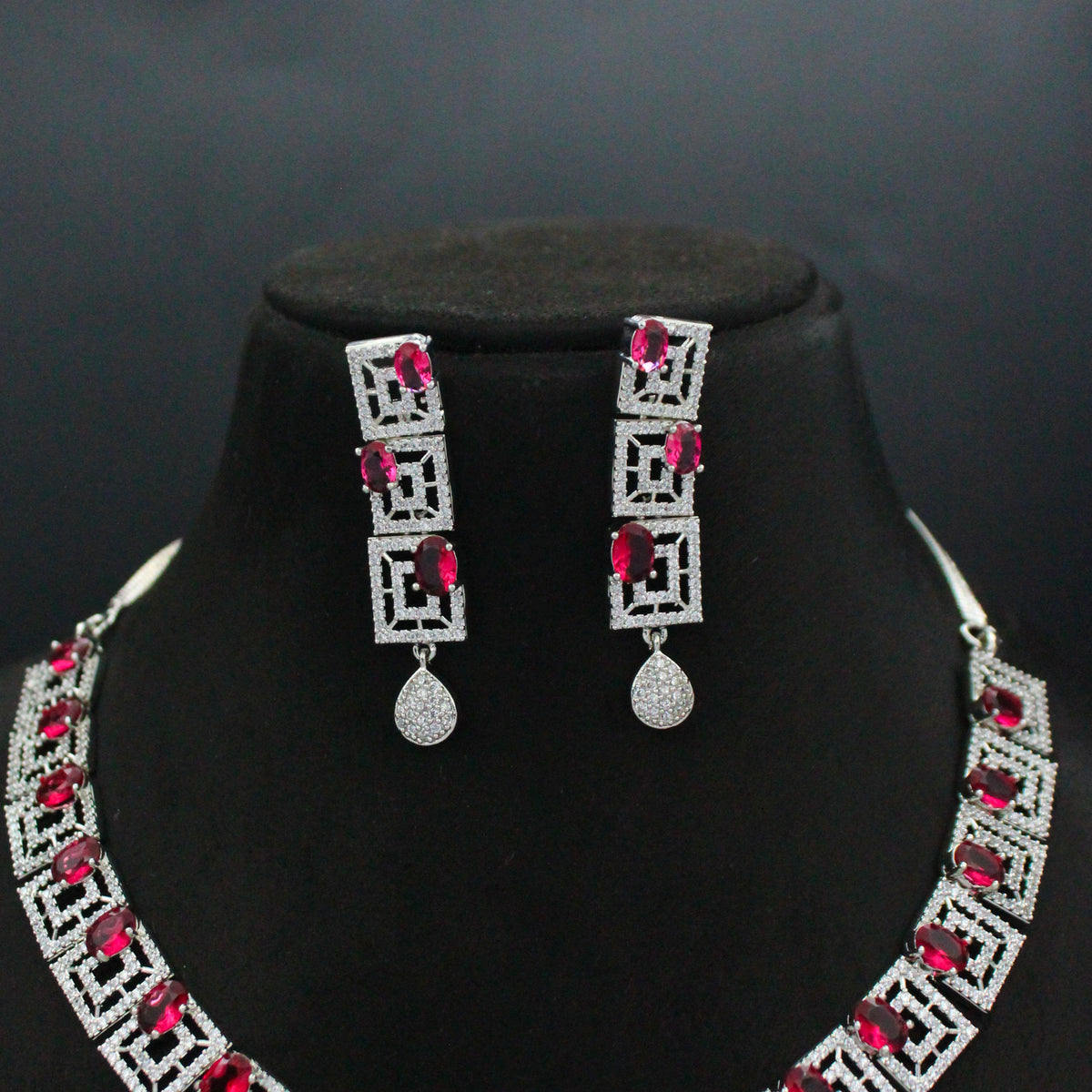 Platinum necklace set with red square stone design