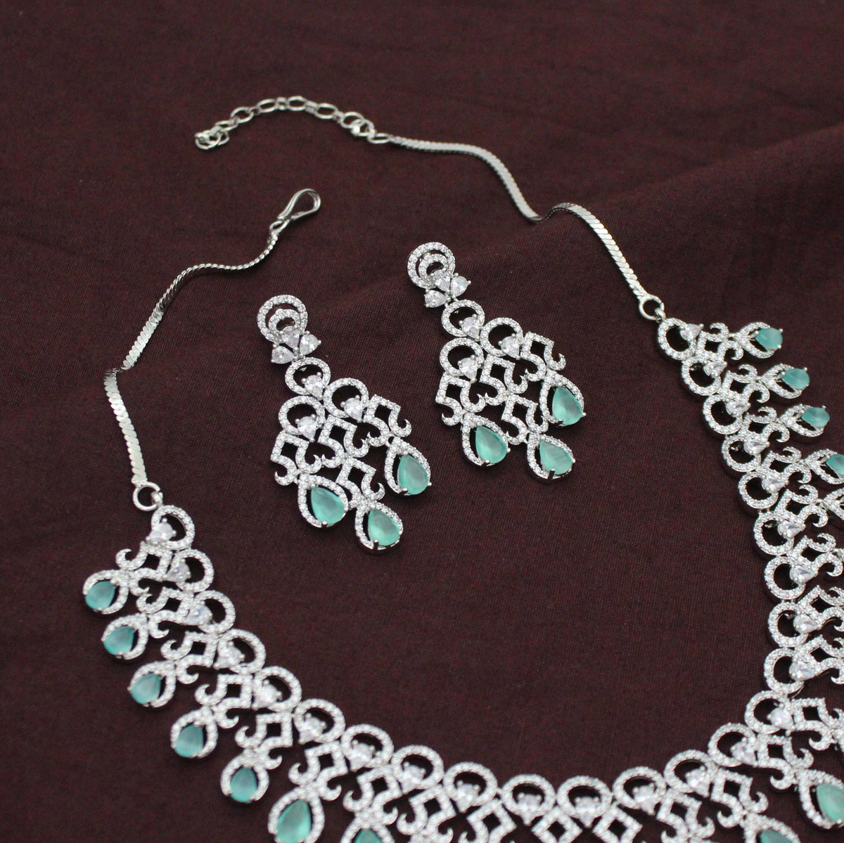 Platinum Party Wear Drop Pattern Mint Green Stones Short Necklace Set With Push Back Earrings 43011