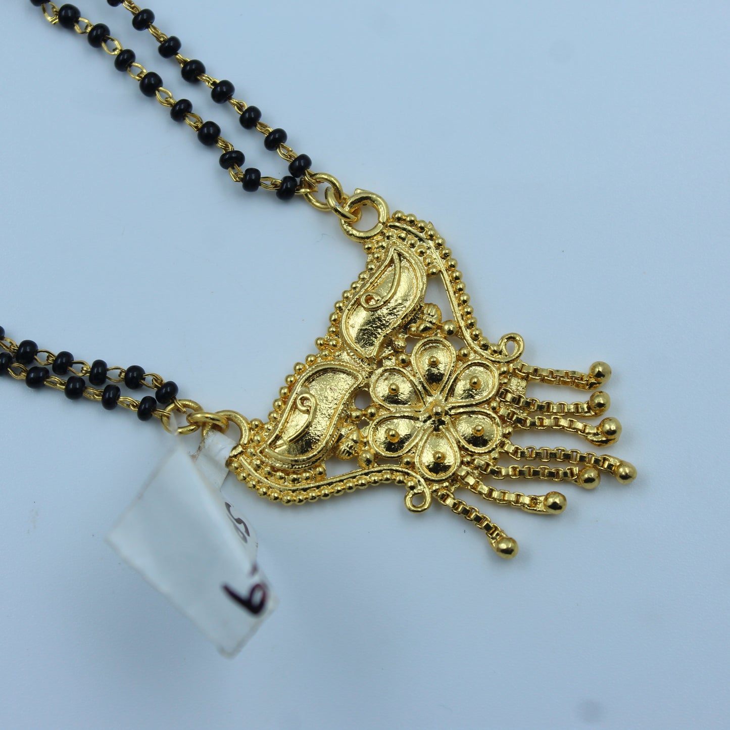 14229 Traditional gold mangalsutra with black beads and  floral pendant design