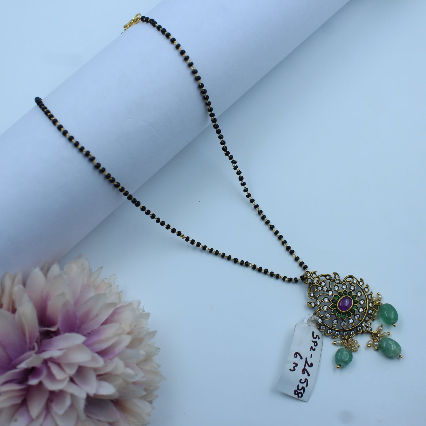 26558  Black Bead Mangalsutra with Green Beads and Pink Stone Pendant