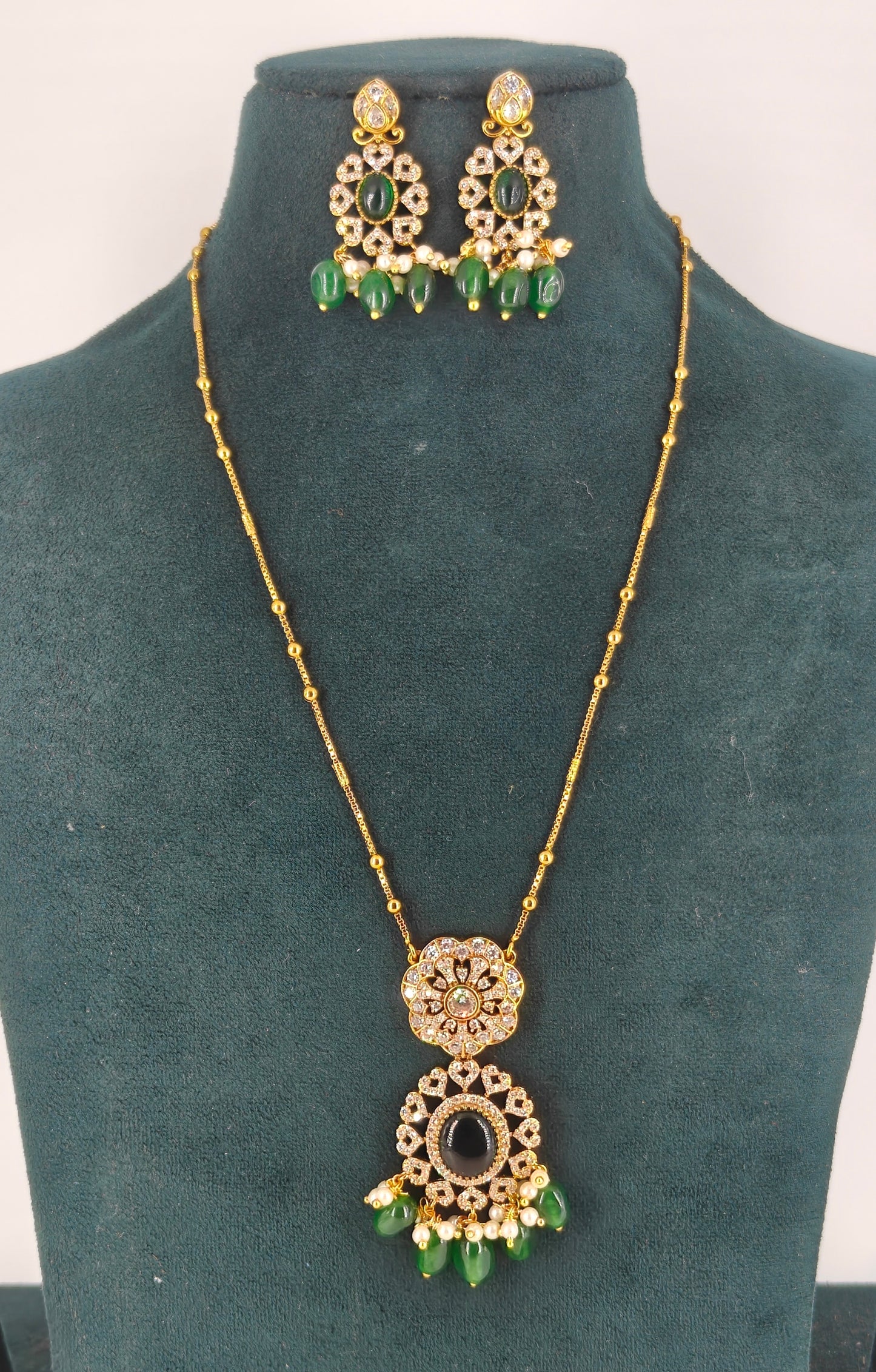 Single line ball chain with pendent set and green stone