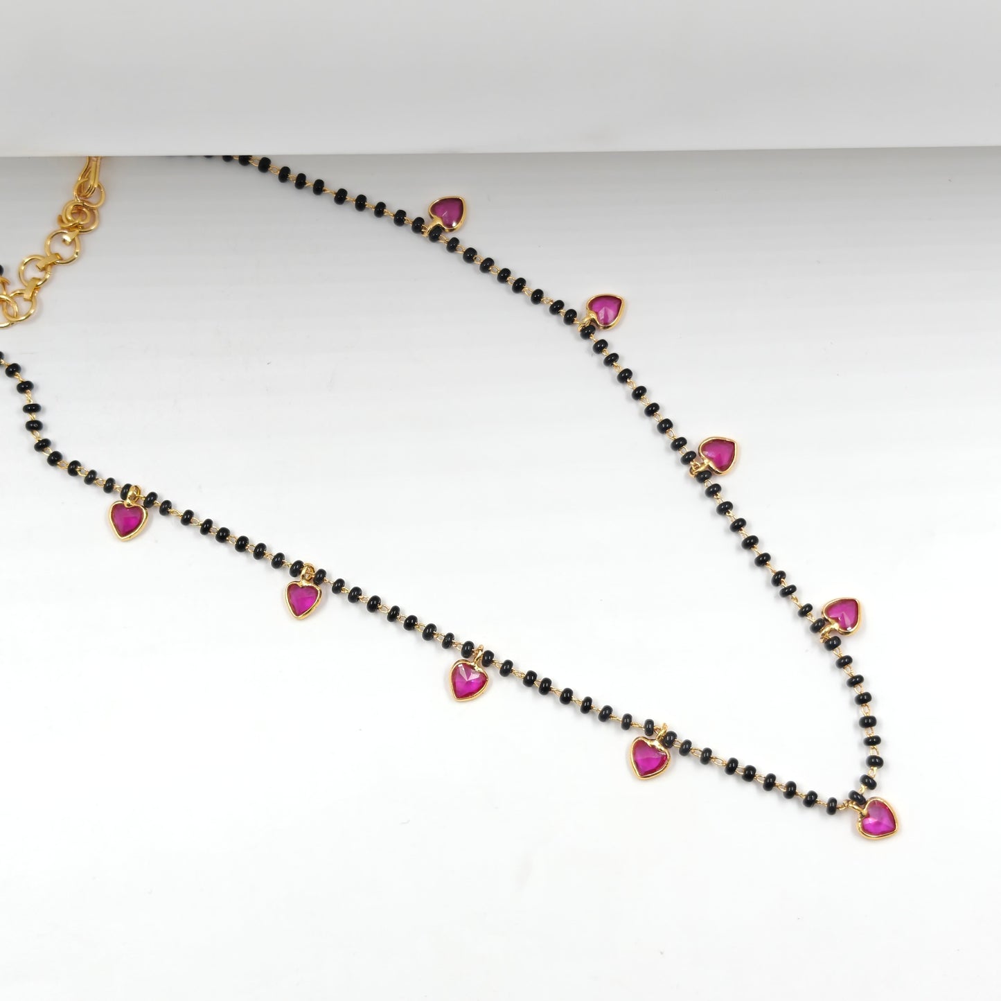 Black beads with drop and heart in red