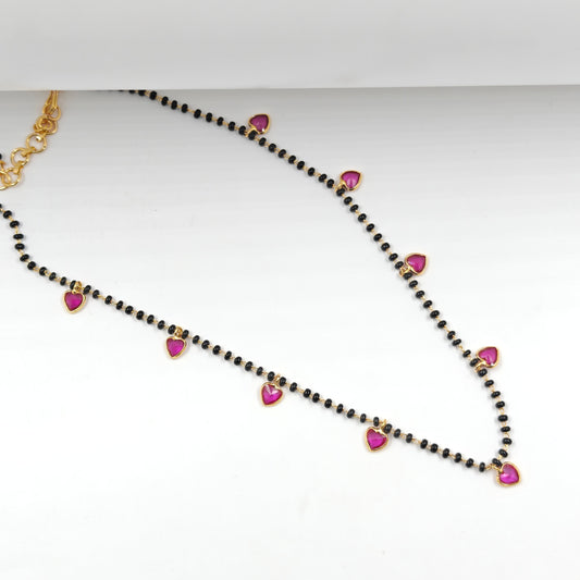 Black beads with drop and heart in red