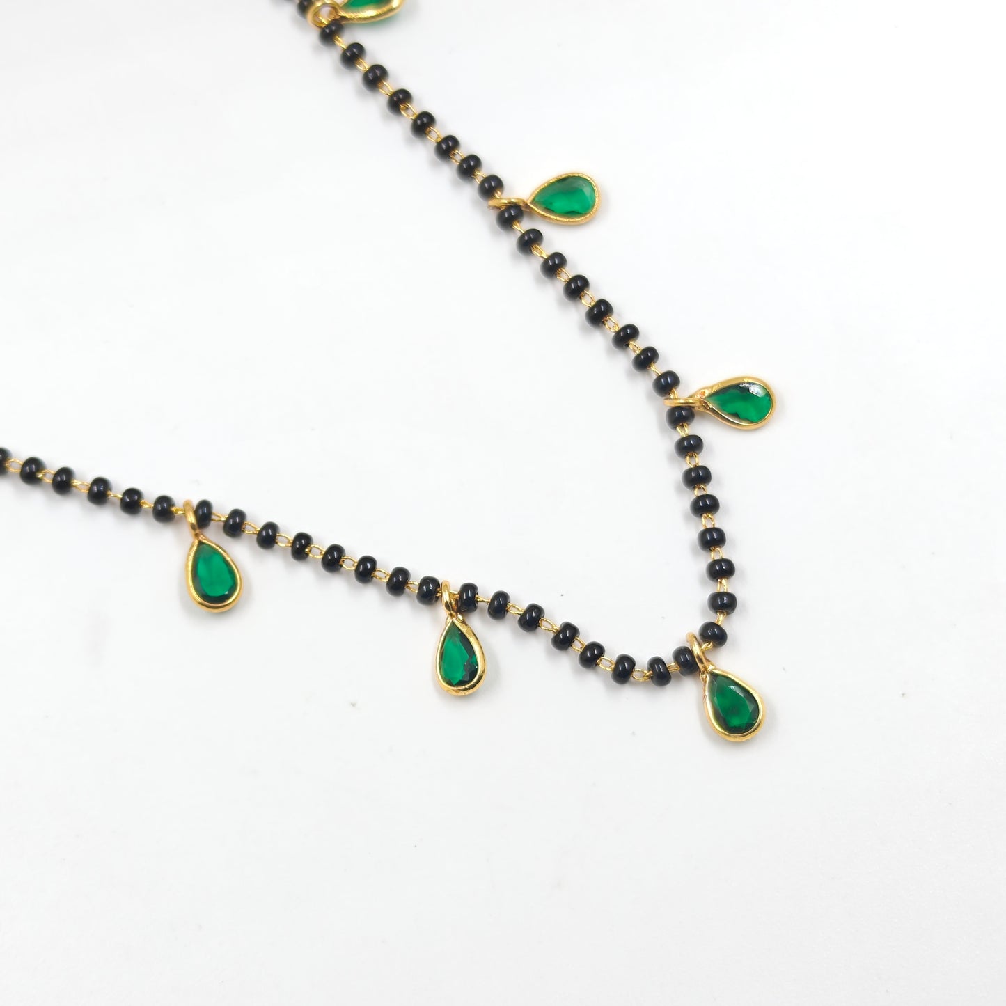 Black beads with drop in green
