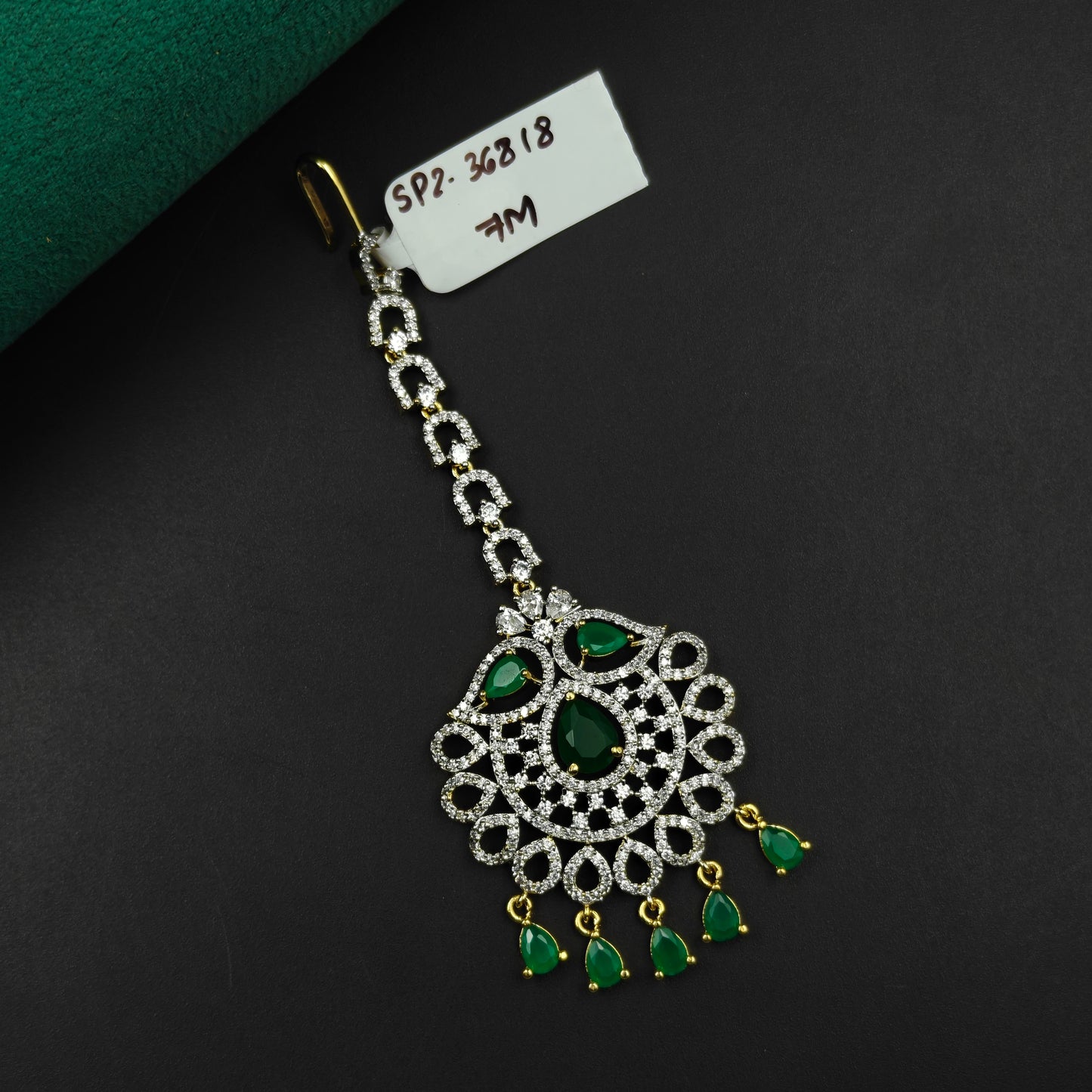 36818 Floral design maangtikka with green stones and white CZ crystals