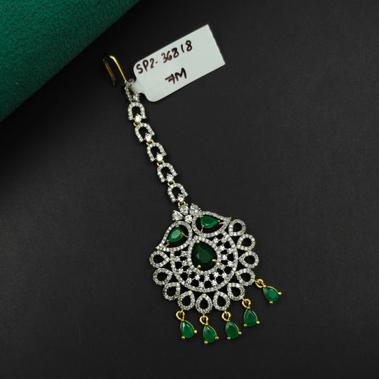 36818 Floral design maangtikka with green stones and white CZ crystals