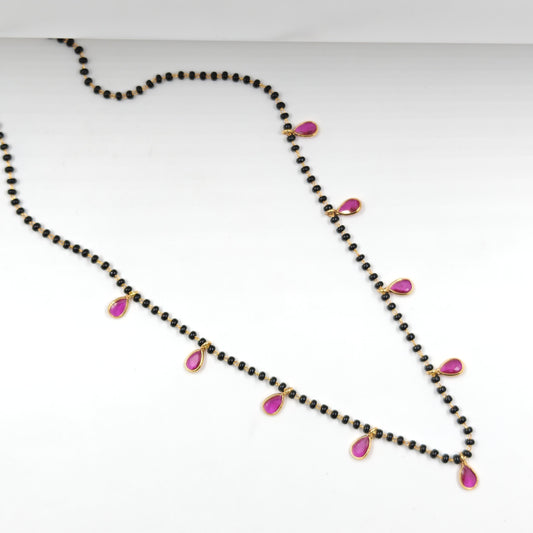 Black beads with drop pattern in red