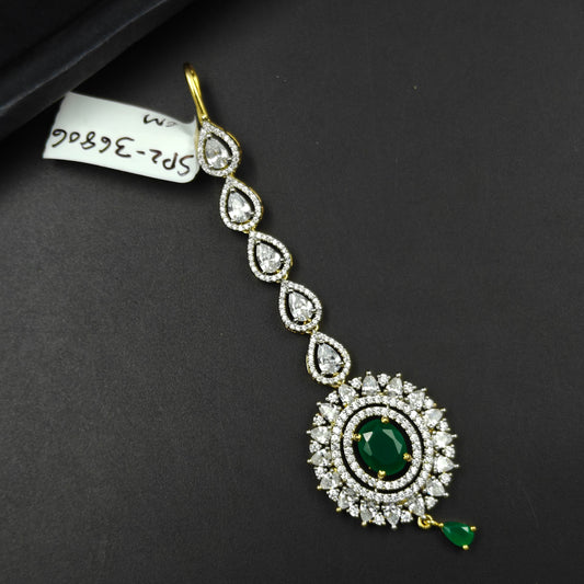 36806 Round design maangtikka with green stone and white CZ crystals