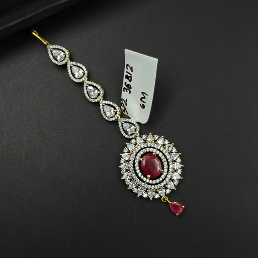 36812 Round design maangtikka with red stone and CZ crystals