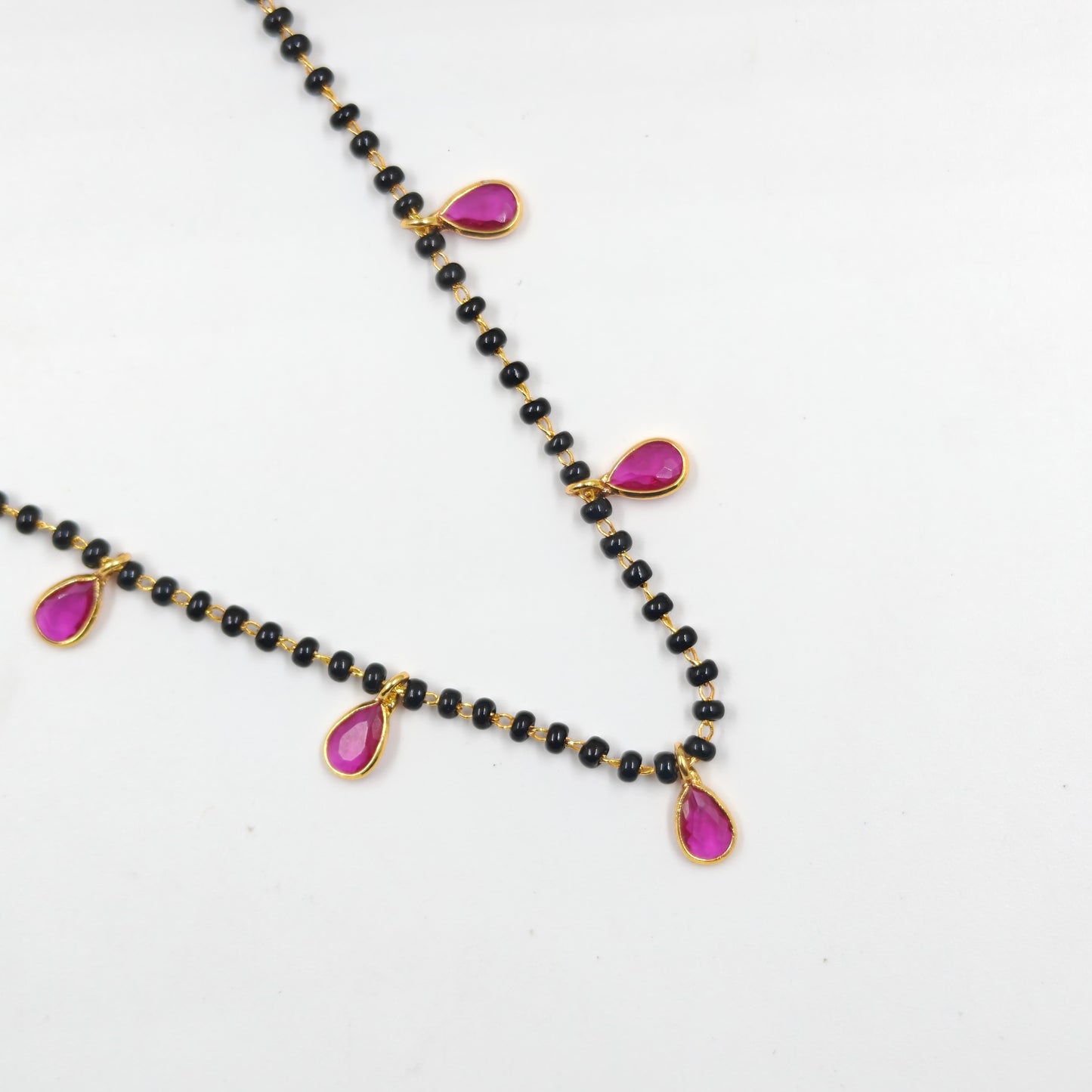 Black beads with drop pattern in red
