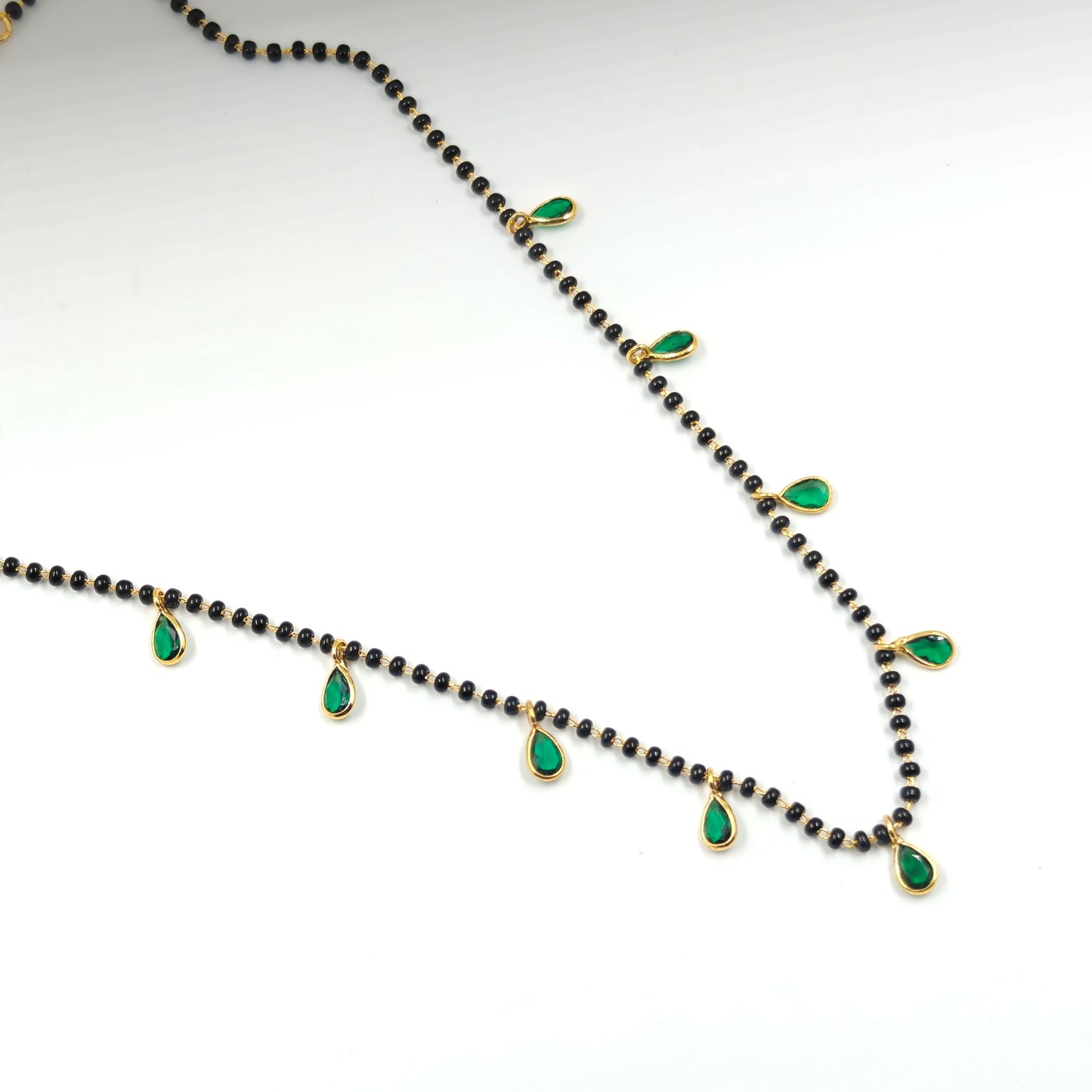 Black beads with drop in green
