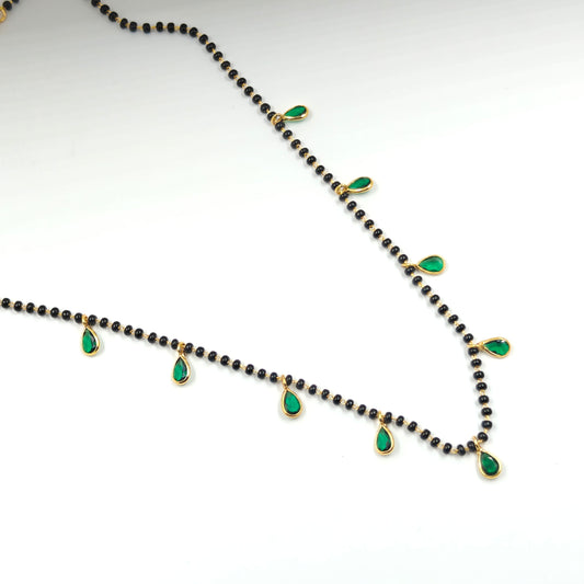 Black beads with drop in green